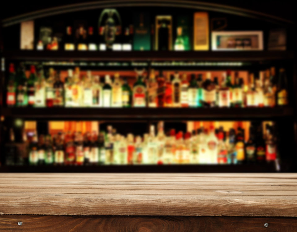 bar with alcohol in the background